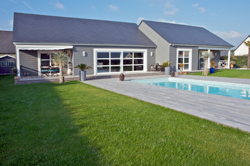 Maison en bois massif isolée par l'extérieur